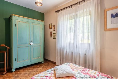 Ένα ή περισσότερα κρεβάτια σε δωμάτιο στο Villa Lolli