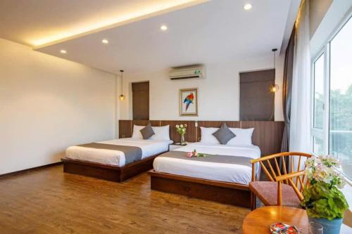 Postel nebo postele na pokoji v ubytování An Phú Villa Sầm Sơn - Venuestay