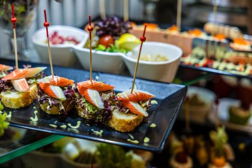 a plate of food on a table with appetizers at MADEN Al Rawda مادن الروضة in Al Madinah