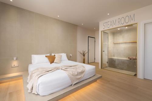 a bedroom with a white bed and a sign that reads stay room at Selected Suites in Chania Town