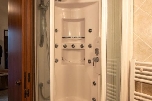 a shower door with a control panel in a bathroom at Alarcon B&B soggiorno storico in Rende