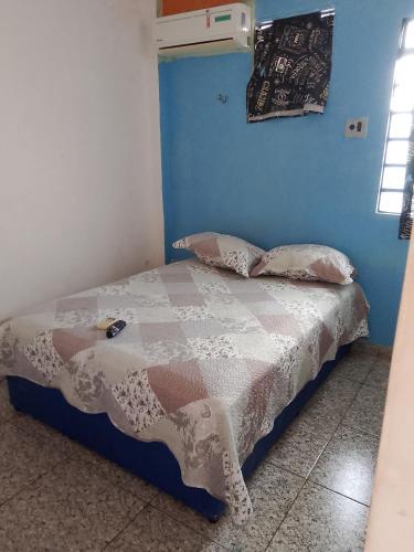Ένα ή περισσότερα κρεβάτια σε δωμάτιο στο Residência Alternativa