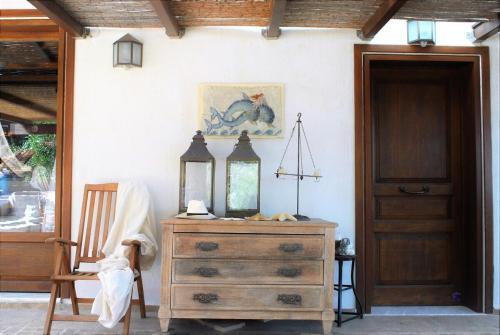 a room with a dresser with a mirror on it at The Poros Villa in Poros