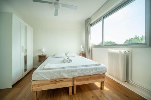 Tempat tidur dalam kamar di Le Ptit Stop