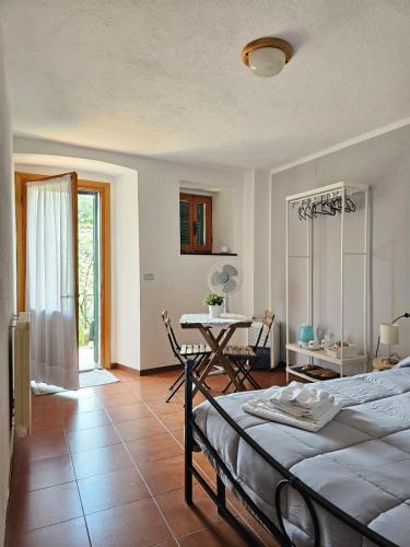 a bedroom with a bed and a table in it at La Lanterna in Corniglia