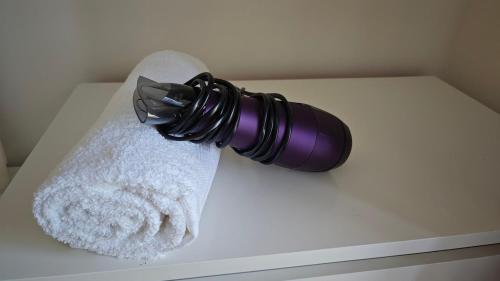 a roll of toilet paper on top of a white counter at Entire Cozy home 5 mins from Dublin Airport in Swords