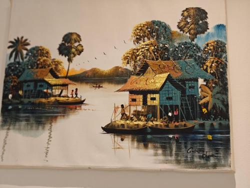 a painting of a house on the water with boats at Entire Cozy home 5 mins from Dublin Airport in Swords