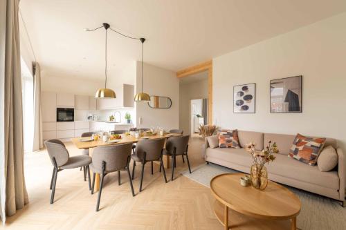 a living room with a table and a couch at Stunning Premium Apartment with Private Rooftop in Copenhagen