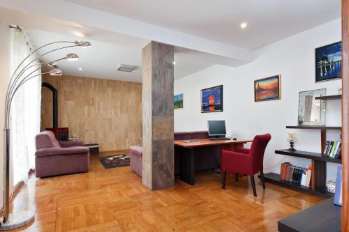 an office with a desk with a computer and two chairs at Villa Marin in Sutomišćica