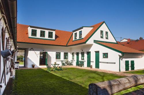 a large white house with an orange roof at Ferienhaus In Angern An Der March in Grub an der March
