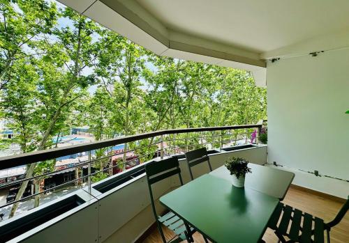 a room with a table and chairs on a balcony at Home Formentor Salou in Salou