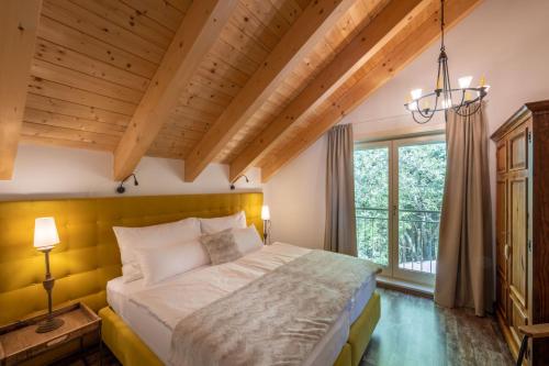 a bedroom with a large bed and a window at Ferienwohnung Landleben In Feistritz Ob Bleiburg in Feistritz ob Bleiburg