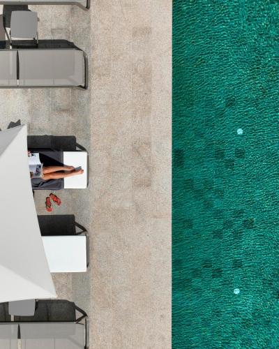 an overhead view of a pool with chairs and water at MS Collection Arouca - Mosteiro de Arouca in Arouca