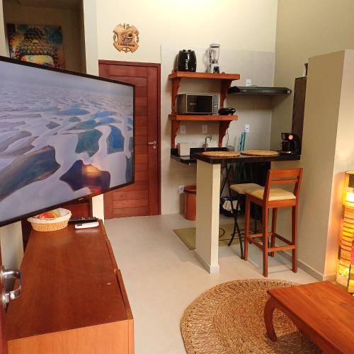 Televisyen dan/atau pusat hiburan di Kite House Lençóis II