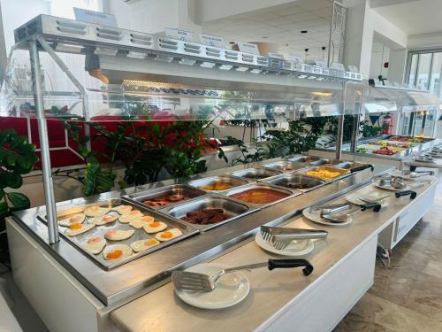a buffet line with many different types of food at Napa Jay Hotel in Ayia Napa