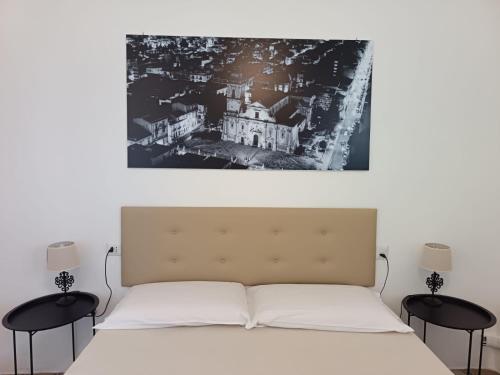 Ένα ή περισσότερα κρεβάτια σε δωμάτιο στο Residenza Donnafugata B&B