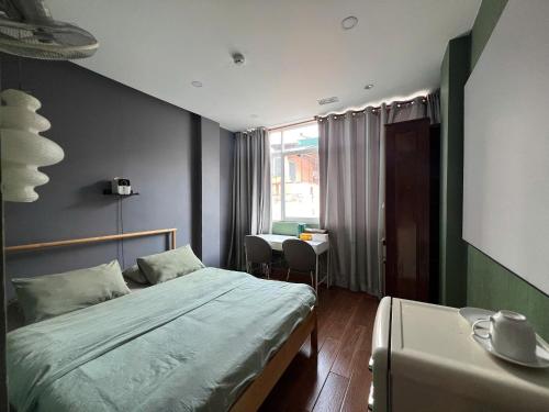 Postel nebo postele na pokoji v ubytování MEOW Hotel & Cafe 2