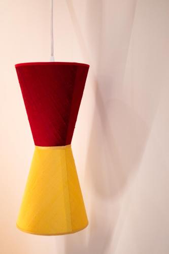 a colorful lamp hanging from a wall at Hotel Casa W in Venice