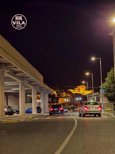 a highway at night with cars parked on the road at Vila HK in Krujë