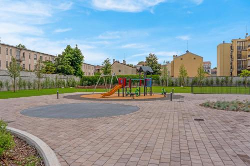 a playground with a slide in a park at Cefalonia Garden with Terrace & Garage by NDP rent in Milan