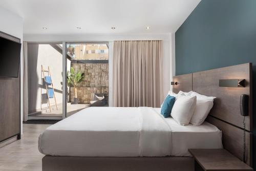 Postel nebo postele na pokoji v ubytování Sette Suites & Rooms - Adults Only