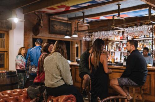 a group of people standing at a bar at Seal Point Lighthouse in Cape St Francis