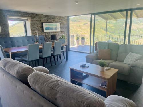 a living room with a couch and a table at Quinta do Casal Bystol - Casa 2 in Casal de Loivos