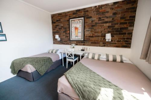 Postel nebo postele na pokoji v ubytování Hornsby Inn