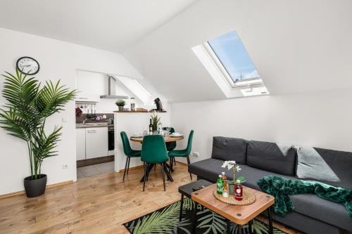 a living room with a couch and a table at MOLA Apartments-Moderne Ferienwohnung im Herdecker Zentrum für 3 Personen-mit Balkon-Grill-Gratis Parkplatz-WLAN in Herdecke