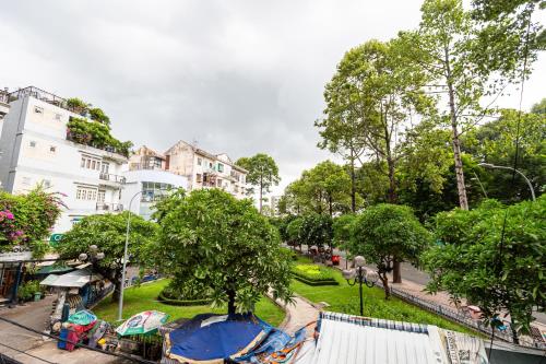 a view of a park with trees and buildings at Brand New Cozy Home in D1 wBalcony in Ho Chi Minh City