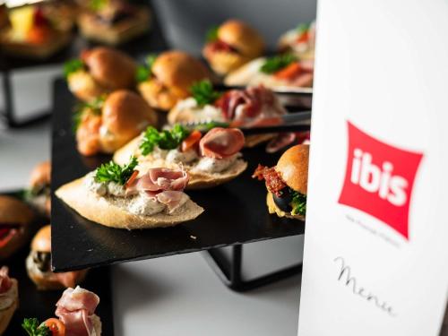 a bunch of sandwiches sitting on a table at Ibis Poznan Polnoc in Suchy Las