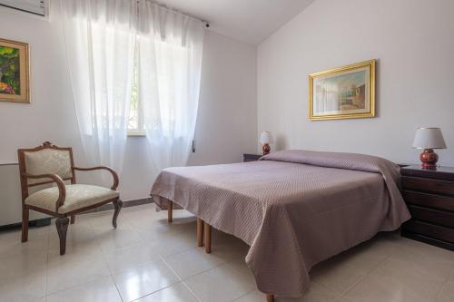 Ένα ή περισσότερα κρεβάτια σε δωμάτιο στο Villa AnnaRò