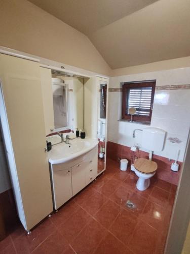 a bathroom with a sink and a toilet at Diego in Rijeka
