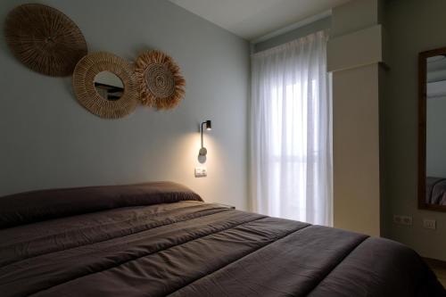 Ένα ή περισσότερα κρεβάτια σε δωμάτιο στο Joyma Boutique Apartments