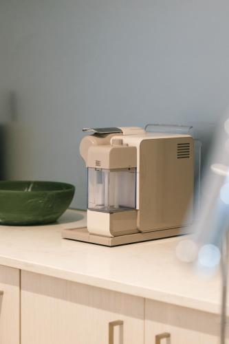 a microwave sitting on top of a kitchen counter at Boho retreat near The Gabba with stunning views in Brisbane