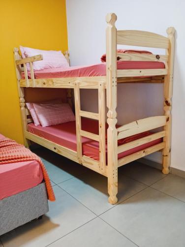 Postel nebo postele na pokoji v ubytování Pousada Família Alegria Hospedaria