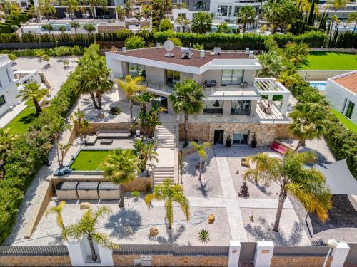 an aerial view of a house with palm trees at Villa Villa Eos by Interhome in Jávea