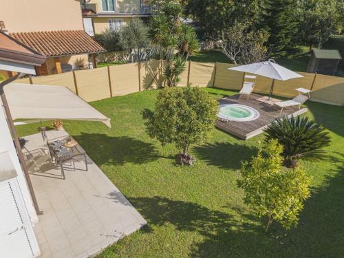 an overhead view of a backyard with a pool and an umbrella at Holiday Home La Frida 2 by Interhome in Stiava