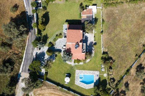 an aerial view of a house with a pool at Villa Aurora Crete in Koxaré