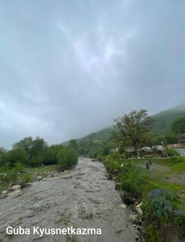 a river with mountains in the background at Quba A-Frame near Lake & Forest in Quba