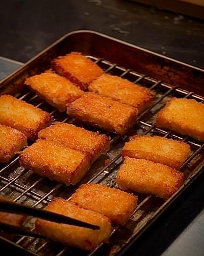 a bunch of food cooking on a grill at 白水温泉竹の倉山荘 in Minami Aso