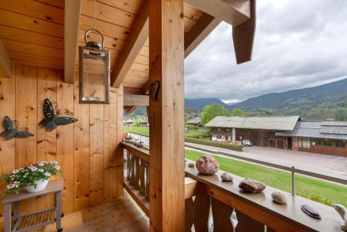 a view from the balcony of a log cabin at Fewo Oberschönauer Bergblick in Schönau am Königssee
