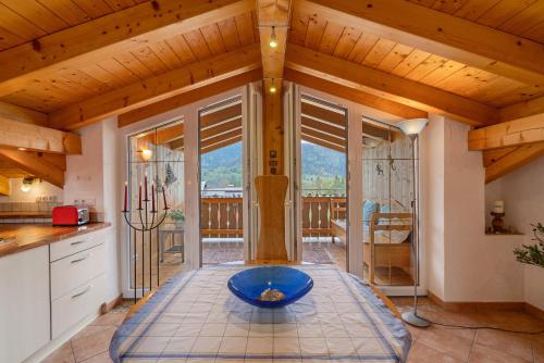 a kitchen with a blue bowl on a table at Fewo Oberschönauer Bergblick in Schönau am Königssee