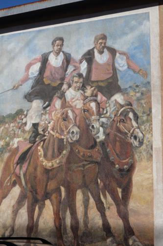 a painting of a group of people riding horses at Capo Coda Cavallo, vacanze nella casa Il Maestrale in Capo Coda Cavallo