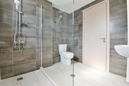 a bathroom with a shower and a toilet and a sink at Elegant Sea View Stay - Piraeus Port in Piraeus