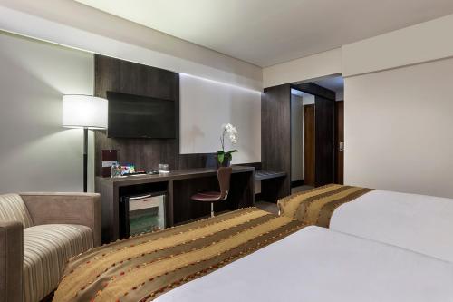 Ένα ή περισσότερα κρεβάτια σε δωμάτιο στο K Hotel