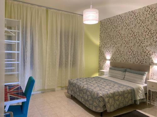 a bedroom with a bed and a large window at Ca' Rosso Venice in Venice