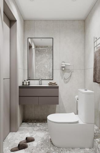 a bathroom with a toilet and a sink and a mirror at Достык Люкс in Kostanay