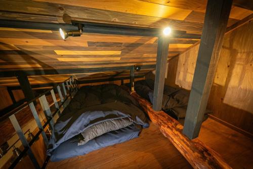Una cama o camas en una habitación de SLEEPY MOUNTAIN