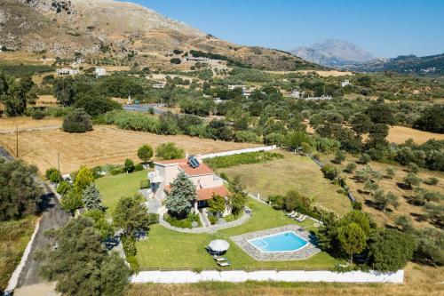 an aerial view of an estate with a swimming pool at Villa Aurora Crete in Koxaré